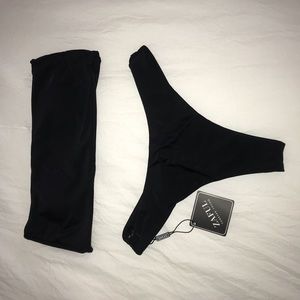 NWT. Size S black swim suit